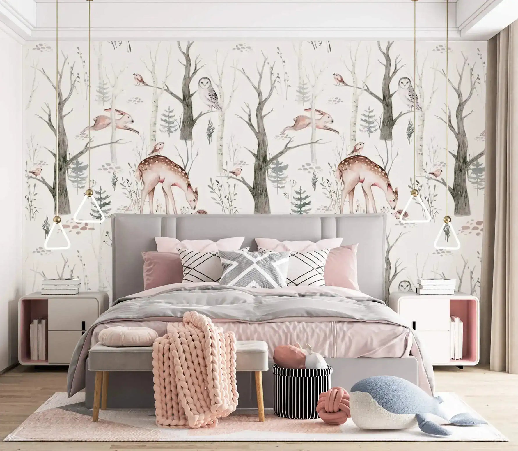 Enchanted Forest deer-and-owl wallpaper in a blush bedroom above an upholstered bed