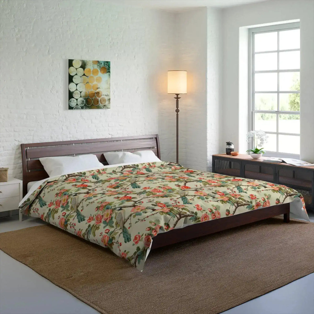 Cream floral comforter with roses and birds on wood bed in white brick bedroom with lamp