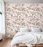 English Garden Wallpaper of pink blooms and green foliage behind a low platform bed with oak nightstand.