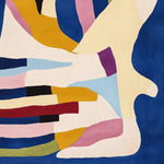 Vibrant area rug with an abstract design featuring bold colors like blue, pink, and mustard, perfect for contemporary living rooms. Ideal as a living room rug in an 8x10 size, this hand-tufted wool rug adds a modern touch to any space.