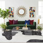 Modern living room with a green sofa, colorful pillows, an abstract wool rug, and decorative items.