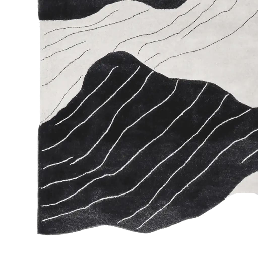 This contemporary area rug, perfect for adding a modern touch to your living room, features a hand-tufted design with striking black and white abstract stream vein patterns. Made from high-quality wool, this living room area rug combines style and comfort effortlessly.