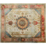 Top view of the Eternal Embellishment Hand Knotted Area Rug showcasing intricate patterns with a central medallion, surrounded by a blend of warm and cool tones in an ornate border design.