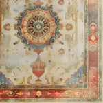 A beautifully detailed hand-knotted area rug featuring an intricate central medallion with vibrant colors and floral patterns. The ornate border adds a touch of elegance, making it a perfect centerpiece for any room.
