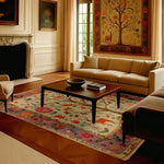 Elegant living room featuring the Eternal Growth Tapestry Hand Knotted Area Rug with a vibrant floral design. This Persian-style rug adds a touch of sophistication to the large living room with its intricate patterns and rich colors, complementing the classic decor.