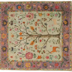 Eternal Growth Tapestry Hand Knotted Area Rug featuring a vibrant floral design with intricate branches and colorful flowers. This Persian-inspired rug is perfect for adding elegance to large living rooms. The detailed border enhances its beauty, making it a standout piece among living room area rugs.