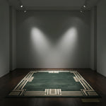 Dark room with a green patterned rug on a wooden floor