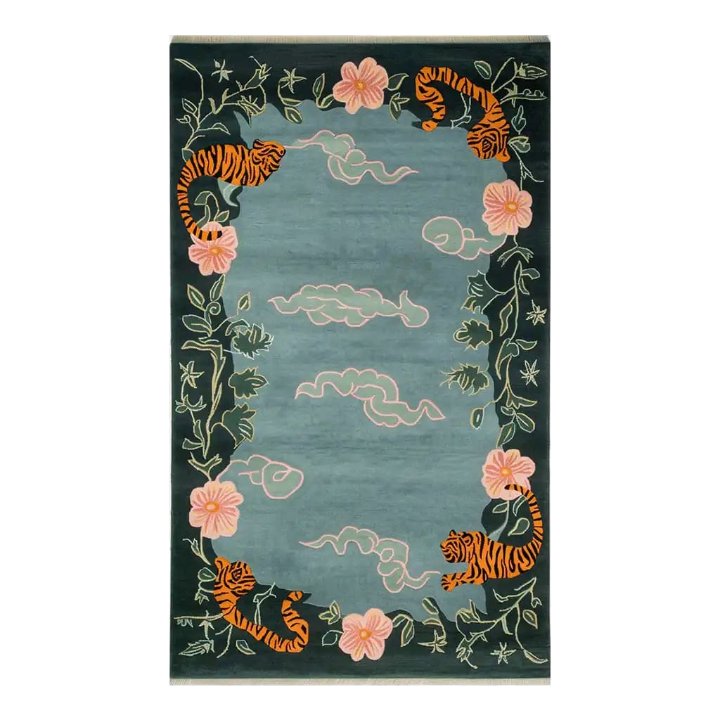Ethereal Blossom Drift Hand Tufted Wool Area Rug featuring an abstract design with tigers, pink flowers, and swirling clouds on a rich green background.