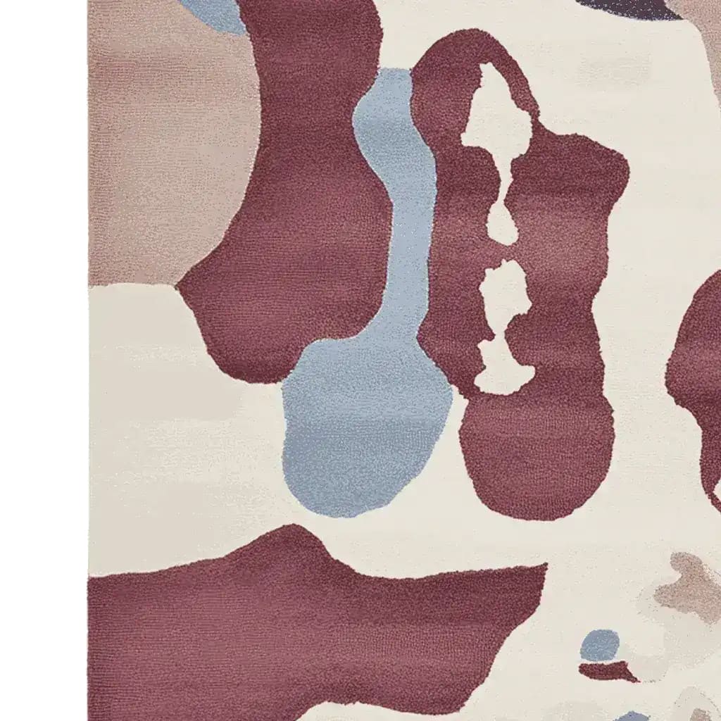 Close-up view of the Ethereal Terrain Hand Knotted Rug, showcasing an abstract design with earthy tones of burgundy, blue, and beige. This contemporary area rug is perfect for large living rooms, offering a modern touch with its wool texture.