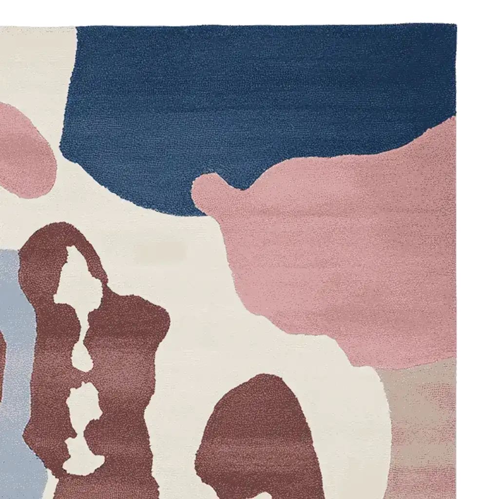 Top view of the Ethereal Terrain Hand Knotted Area Rug featuring an abstract design with rich hues of blue, pink, and brown. This contemporary rug is perfect for adding a modern touch to large living rooms. Made from high-quality wool, this area rug offers both style and durability.