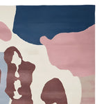 Top view of the Ethereal Terrain Hand Knotted Area Rug featuring an abstract design with rich hues of blue, pink, and brown. This contemporary rug is perfect for adding a modern touch to large living rooms. Made from high-quality wool, this area rug offers both style and durability.