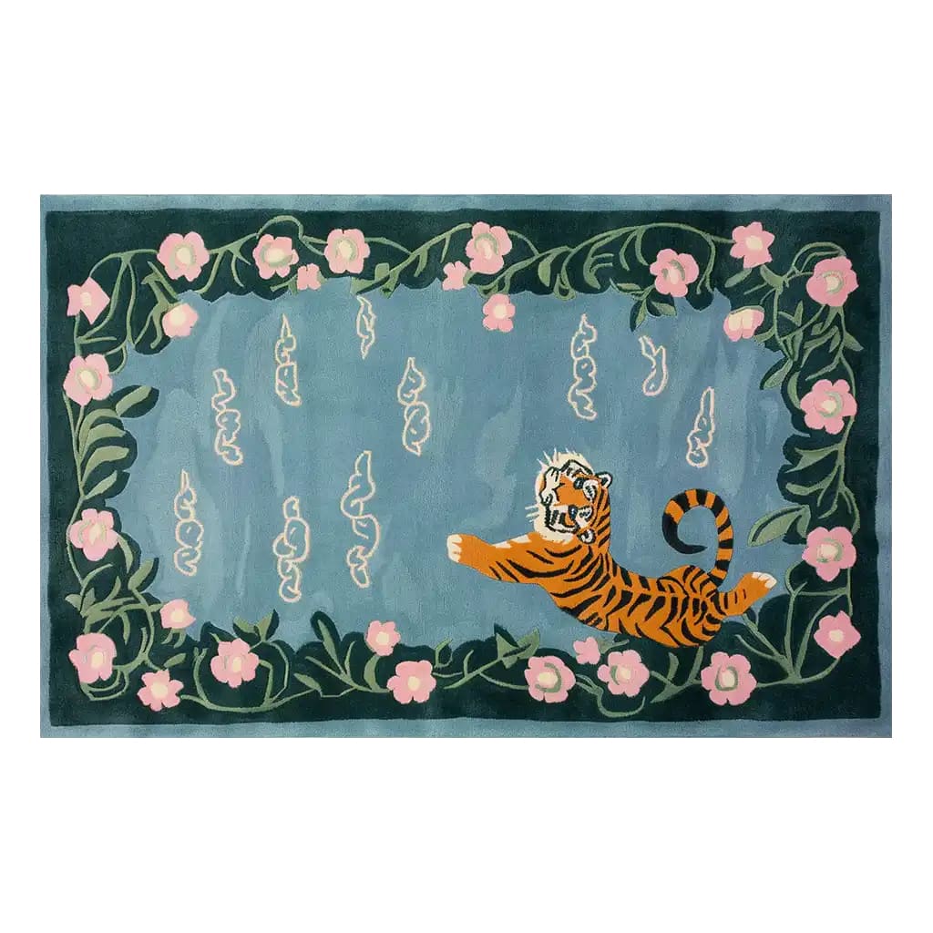 A beautifully designed area rug featuring an abstract depiction of a tiger in a serene pose. The rug is adorned with intricate floral patterns and vibrant colors, providing a striking contrast against the rich background. This hand-tufted wool rug adds an artistic touch to any living space.