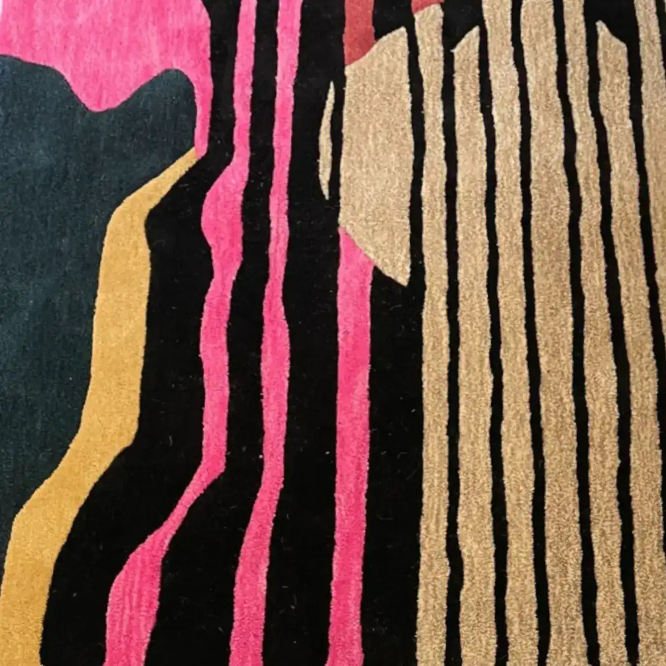 A vibrant area rug featuring an abstract design with bold stripes in pink, black, and earthy tones, perfect for large living rooms or dining spaces. This contemporary wool rug adds a modern touch to any living room area.