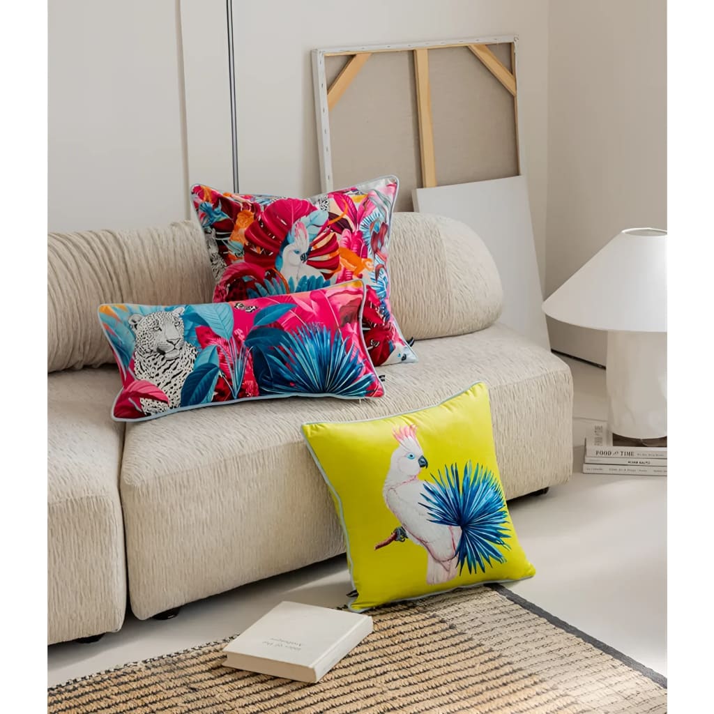 Vibrant throw pillows featuring tropical designs with exotic birds and lush foliage, perfect for adding a pop of color to any space.