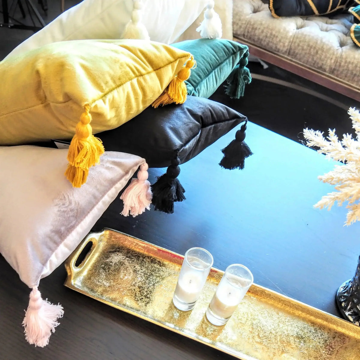 Extra skinny throw pillow with tassels in black, perfect for adding style and comfort to your living space.