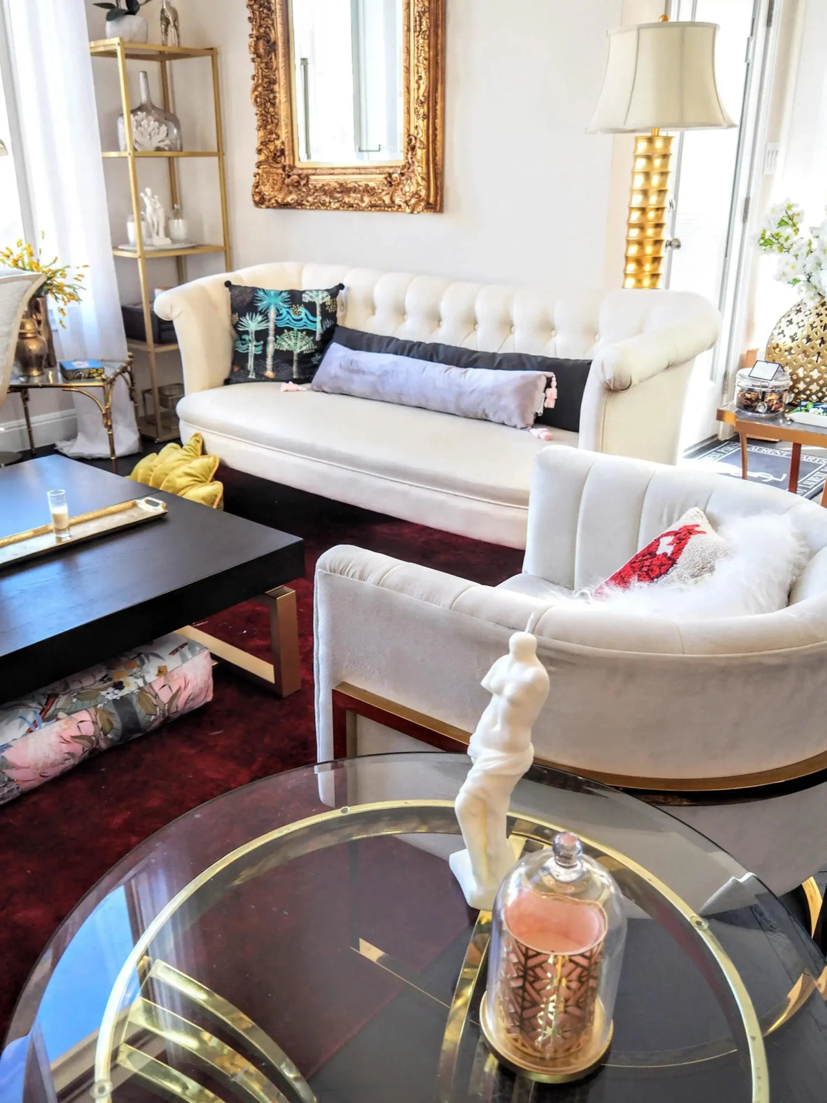 Extra skinny black lumbar throw pillow with tassels, styled on a chic couch in a modern living room setting.