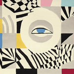 The Eye Spy Chaos Hand Tufted Rug features a bold and abstract pattern with a prominent eye design in the center. This contemporary area rug showcases a mix of geometric shapes and vibrant colors, making it an ideal wool rug for large living room spaces. Perfect for adding a touch of modern art to your living room area.