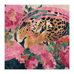The Eyes of Flame Hand Tufted Rug is a vibrant square area rug featuring an abstract design with a leopard surrounded by pink and green floral patterns. This wool rug is perfect for adding a bold statement to large living room spaces.