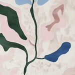 Close-up image of the Fading Petal Motion Hand Tufted Area Rug showcasing a contemporary abstract design with green, pink, and blue petal-like shapes. Perfect wool rug for enhancing any living room with a modern touch.