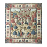 A beautifully detailed hand-knotted area rug featuring a vibrant fantasy castle scene. The rug displays a whimsical castle surrounded by colorful trees and intricate border patterns, creating a captivating centerpiece for any room.