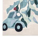 A whimsical hand-tufted area rug featuring a playful design of a car in cool blue tones, perfect for adding a touch of fun to living rooms. Ideal as a wool rug for an 8x10 space, this piece brings artistry and warmth to any room.
