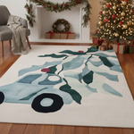 Decorative rug with a Christmas tree design in a living room with a Christmas tree and presents.