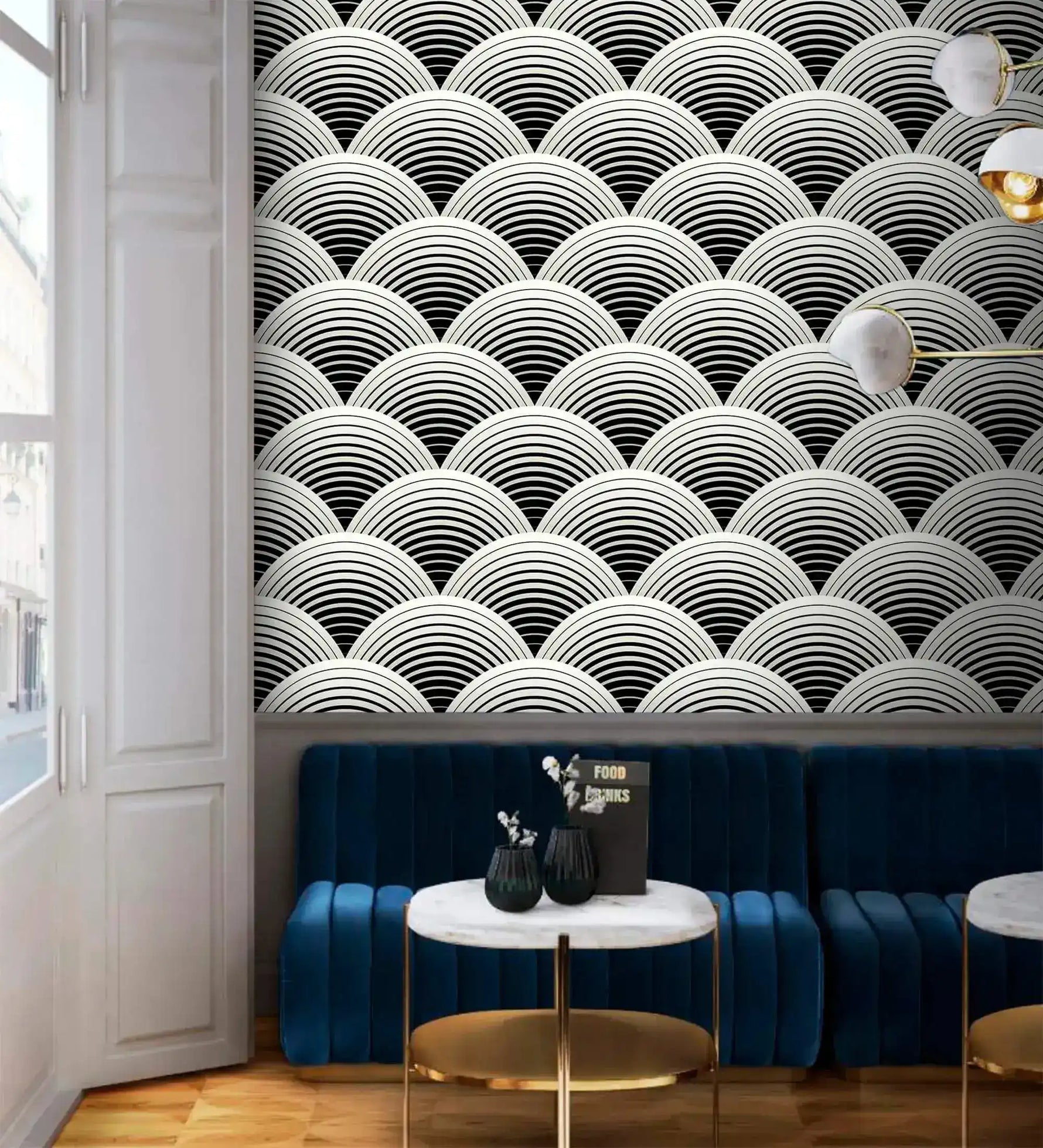 Fish scale art deco wallpaper above blue velvet banquette, black and white scalloped fan pattern