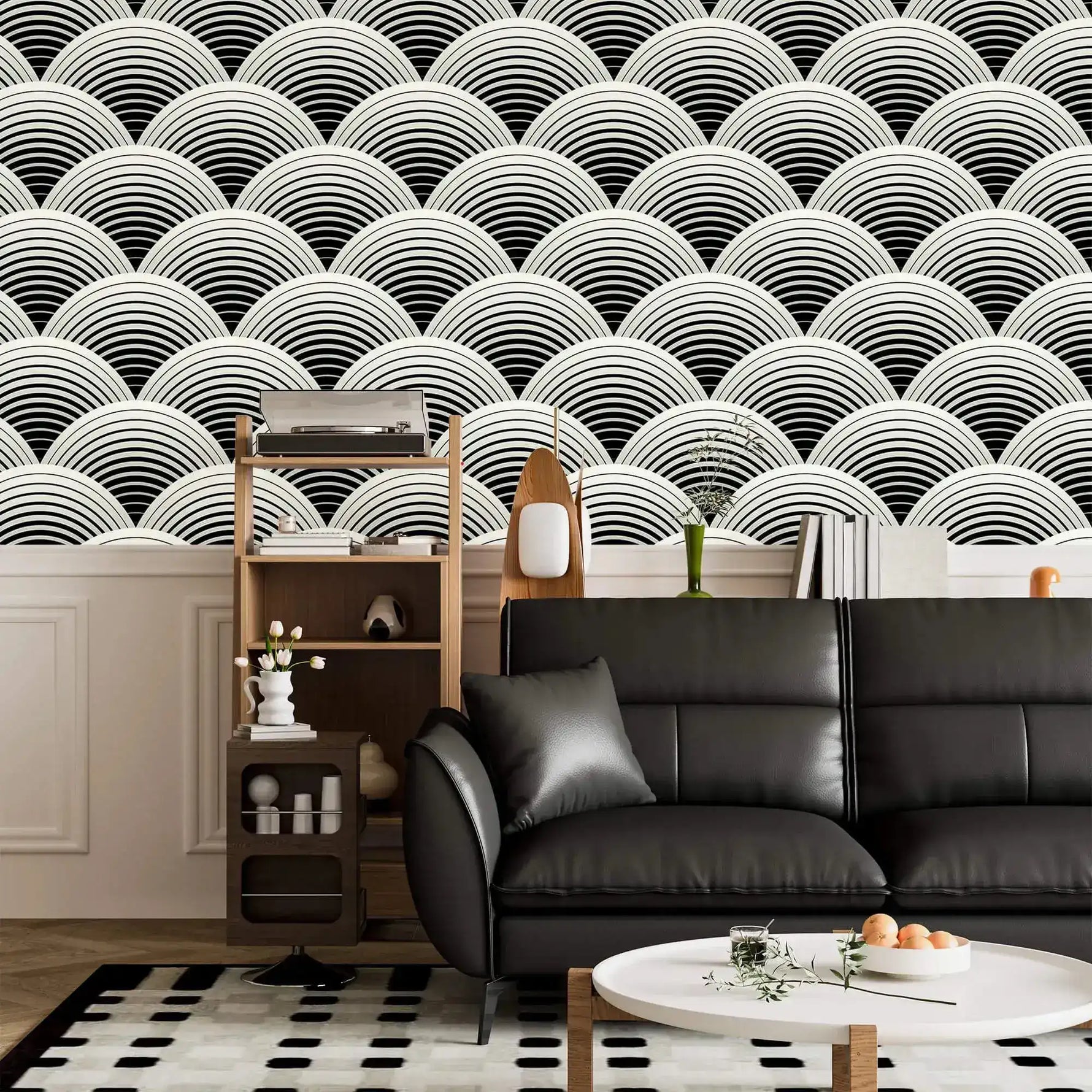 Fish scale art deco wallpaper in living room, black and white scalloped fans above a black leather sofa