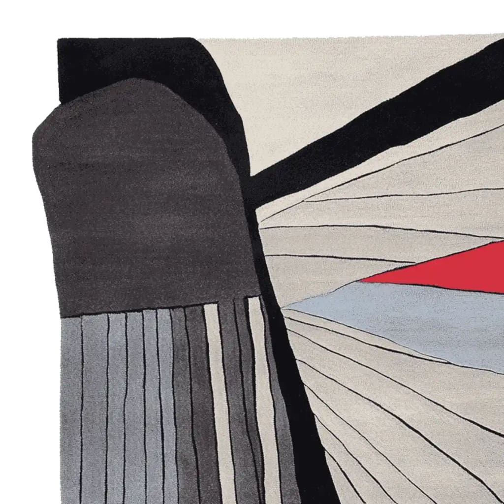 Close-up view of the Flight Diagram Hand Tufted Rug, showcasing a contemporary design with bold black, grey, and red abstract patterns. This wool area rug is perfect for large living rooms, offering a stylish and modern touch to any space.