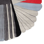 Stylish and contemporary area rug featuring an abstract design with flowing lines and bold colors, perfect for large living room spaces. This wool rug adds a modern touch, ideal for those seeking rugs for living room aesthetics.