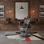 Barbershop interior with a vintage-style chair, brick wall, and framed pictures.