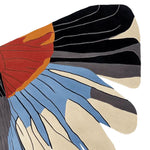 A contemporary hand-tufted wool area rug featuring an abstract design with vibrant colors including red, orange, blue, black, and beige. Ideal for adding a modern touch to any living room.