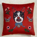 Decorative throw pillow featuring a vibrant red background with an embroidered cat design surrounded by flowers and butterflies, perfect for adding a pop of color to any space.