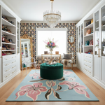 Modern master closet room with white shelves, floral rug, and decorative elements.