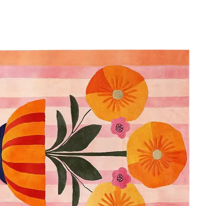 Top view of a vibrant Floral Chalice Hand Tufted Wool Rug, showcasing bold orange and pink floral designs set against a striped background. This area rug is perfect for adding a pop of color to living room spaces, particularly in an 8x10 size. Made from high-quality wool, this rug combines durability with eye-catching style.