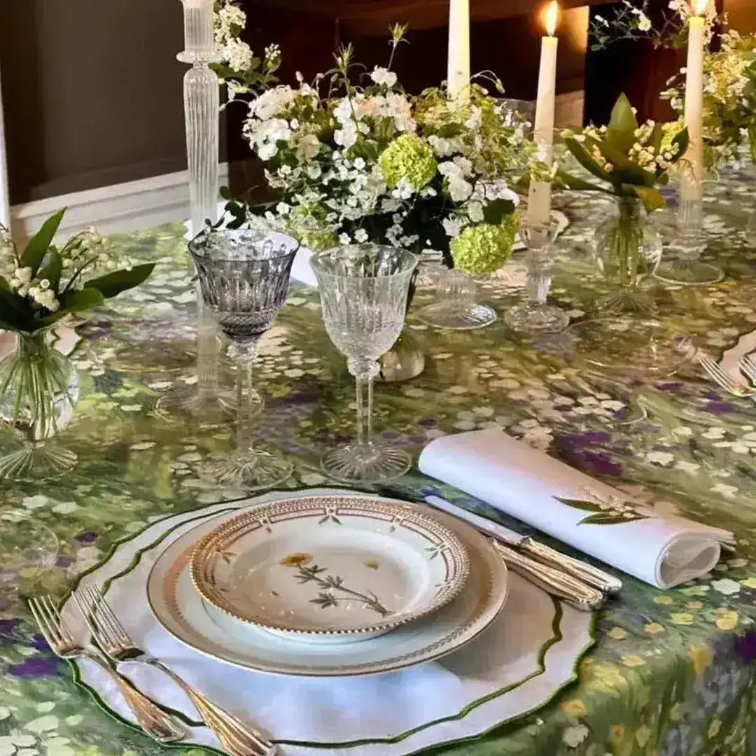 floral elegance placemat in green purple botanical print under white gold-rimmed plate crystal glassware candlelit table
