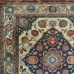 A detailed view of the Floral Euphoria Hand Knotted Area Rug, showcasing an intricate design of vibrant floral patterns in rich hues. This vintage rug features a Persian-inspired motif, perfect for adding a touch of elegance to living rooms. Ideal as an 8x10 area rug, it blends seamlessly with both traditional and modern decor styles.