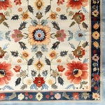 A beautiful Floral Extravaganza Wool Hand Knotted Area Rug showcasing an intricate pattern of vibrant flowers. Ideal for enhancing the elegance of bedrooms, living rooms, and dining rooms, this Persian-style wool rug offers a touch of luxury and warmth.