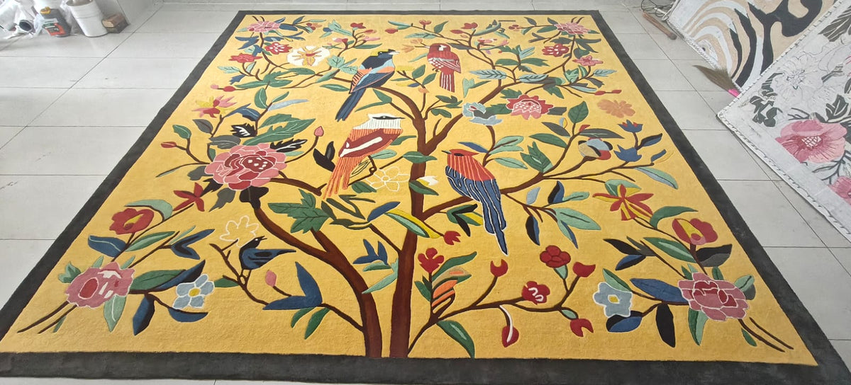 Decorative rug with colorful tree and birds design on a yellow background