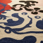 Close-up of a textured rug with black and blue designs