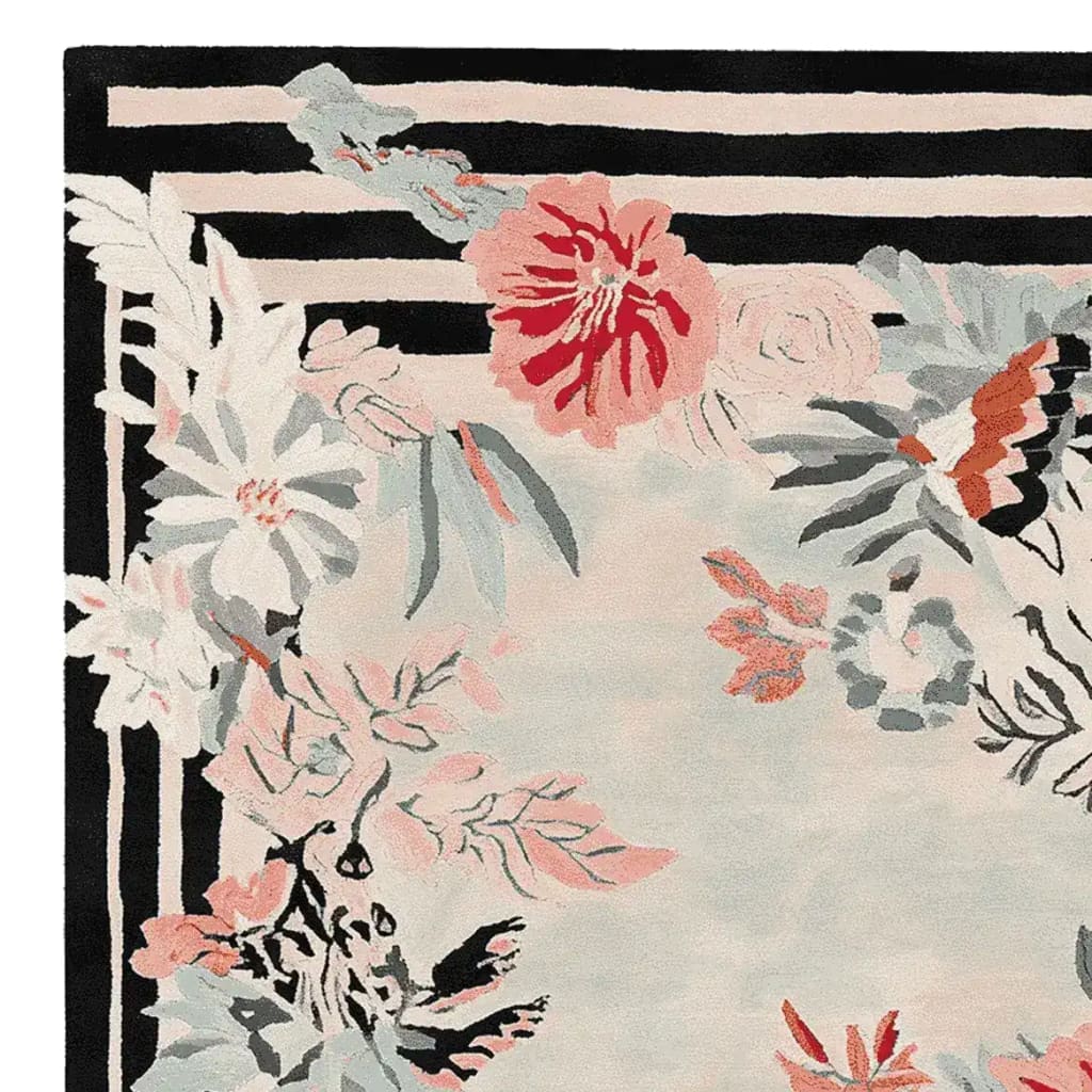 A beautifully detailed area rug featuring a hand-tufted floral design with vibrant red and soft pastel blooms, ideal for adding a touch of elegance to a living room. This wool rug showcases a harmonious blend of colors and intricate patterns, perfect for those seeking rugs for living room spaces.