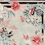 A beautifully intricate area rug designed for living rooms, showcasing a hand-tufted floral pattern with lush pink and coral flowers against a soft background. This wool rug adds elegance and comfort to any space, making it a perfect choice for those seeking stylish rugs for living room decor.