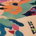 Close-up of a colorful patterned rug with abstract shapes and vibrant colors.