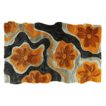 Top view of the Floral Groove Valley hand-tufted area rug, featuring a contemporary design with bold orange floral patterns against a black and cream background. This wool rug adds a vibrant touch to any living room, perfect for those seeking unique area rugs for living room decor.