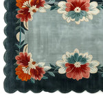Top view of the Floral Harmony Hand Tufted Wool Rug featuring vibrant floral patterns in red, orange, and teal on a sophisticated dark background. This beautiful area rug is perfect for adding a touch of elegance to living rooms. Ideal for spaces needing an 8x10 wool rug, it combines artistry with functionality, making it a standout choice for area rugs in any living room setting.