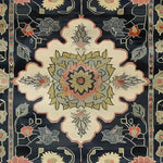 A beautifully hand-knotted wool area rug featuring intricate floral designs with a Persian-inspired motif. This medium-sized rug showcases a harmonious blend of colors, making it perfect for enhancing the aesthetic of your living room or office space. Ideal for those seeking elegant and timeless living room area rugs.