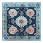 A beautifully crafted floral mosaic hand-tufted square area rug, perfect for enhancing living room decor. This wool rug features intricate floral patterns in soft blues and pinks, ideal for adding a touch of elegance to any space.
