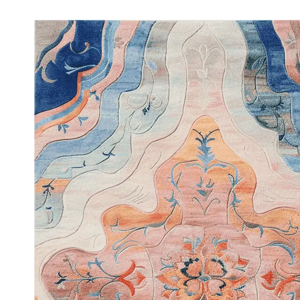 This is a close-up view of the Floral Muse Reverie Hand Tufted Area Rug, showcasing an intricate floral design with vibrant colors. The large living room rug features a blend of blues, pinks, and oranges, making it a perfect wool rug for adding elegance to any space. Ideal for those seeking an 8x10 floral rug to enhance their decor.