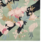 A beautifully detailed area rug featuring a floral design with pastel colors and intricate patterns. This wool rug is perfect for adding a touch of elegance to living room area rugs, capturing the essence of a floral muse trail.