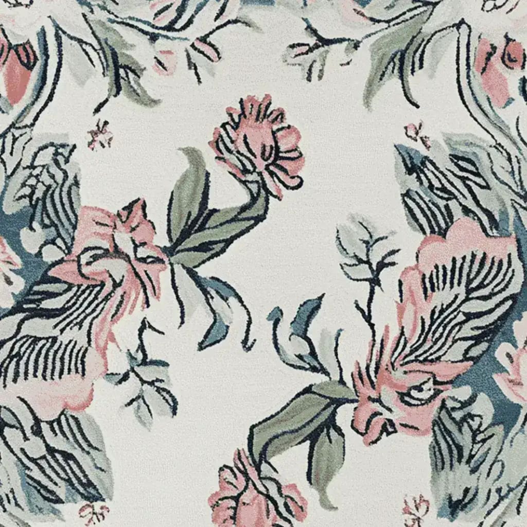 Close-up view of the Floral Reverie Hand Knotted Rug, showcasing an intricate floral design in soft pink and green hues on a wool square area rug, perfect for enhancing the elegance of living room spaces.